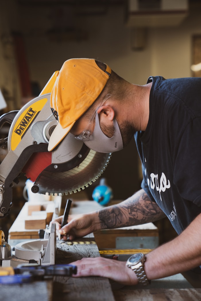 Craftsman planing a wooden board
